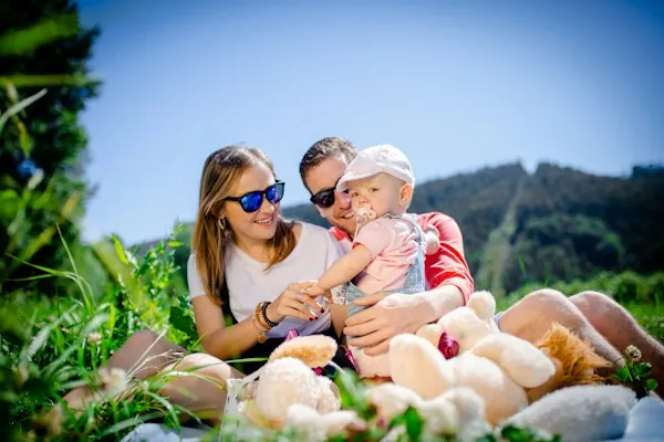 A parent working at home with family nearby